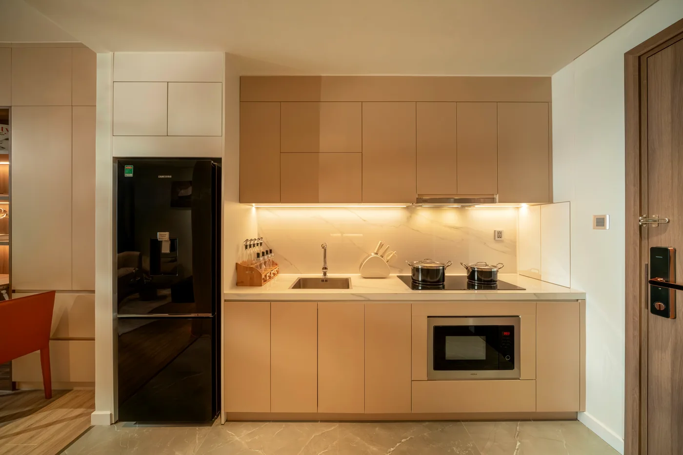 Full kitchen in an apartment at Maison D’Rose Đà Nẵng