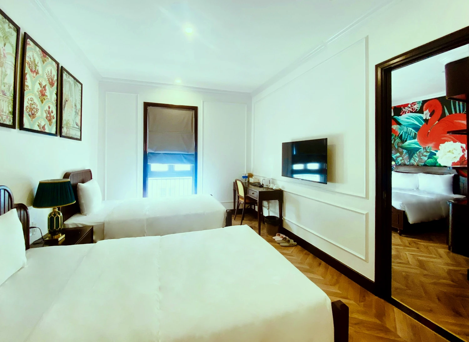 A Family Room at Maison D’Rose Phú Quốc seen from the twin side, the connecting door open onto the second bedroom